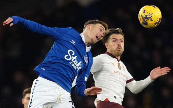 Jack Grealish, right, in action for Manchester City against Everton on Wednesday (Martin Rickett/PA)