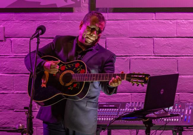 Musician Mateo Guzman plays guitar for Los Cien guests at the Luther Burbank Center for the Arts during the 10th Annual Latinx Cultural Experience to celebrate Latinx culture through food, art and musical performances, Friday August 25, 2023 in Santa Rosa. (Chad Surmick / The Press Democrat)