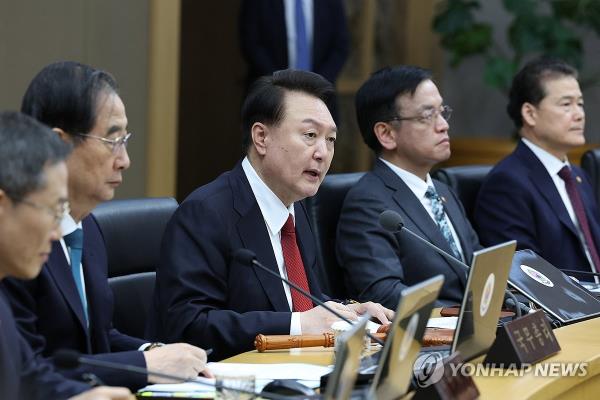 President Yoon Suk Yeol (C) speaks during a Cabinet meeting at the government complex in Sejong, 113 kilometers south of Seoul, on March 6, 2024. (Yonhap)