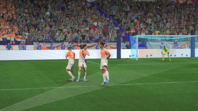A ball whizzes over the three-man wall in FIFA 23.