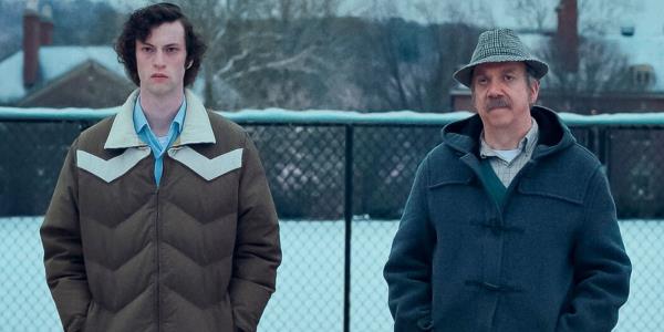 Paul Giamatti in The Holdovers with his student in the snow