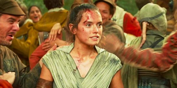 Rey (Daisy Ridley) surrounded by celebrating Rebels in Star Wars: The Rise of Skywalker