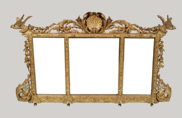 An Irish 19th-century carved giltwood overmantel  at Sheppard's.  An Irish 19th-century carved giltwood overmantel  at Sheppard's.