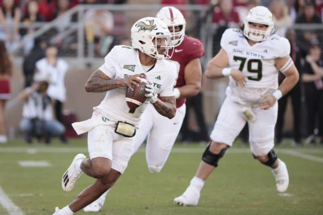 Sacramento State quarterback Kaiden Bennett runs out of the pocket as he looks to pass during the first half against Sacramento State in Stanford, Saturday, Sept. 16, 2023. (Santiago Mejia / San Francisco Chronicle)