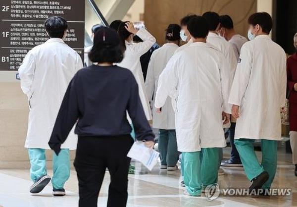 Medical workers walk inside a large general hospital in Seoul on April 17, 2024. (Yonhap)